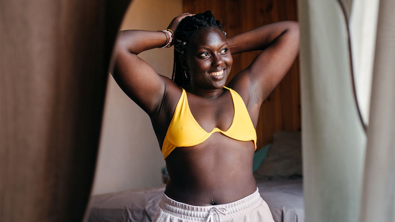 Mature Woman Holding A Tape Measure Over Her Bra Stock Photo