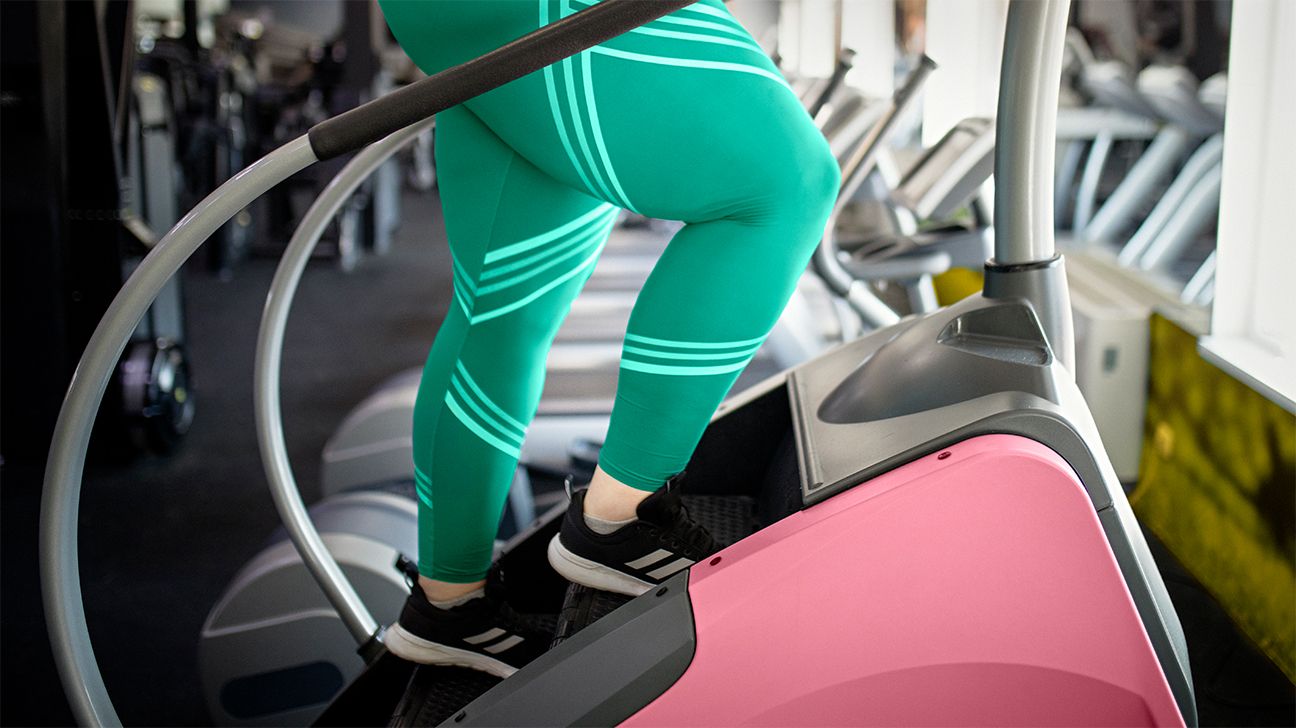 person on stairmaster green pants