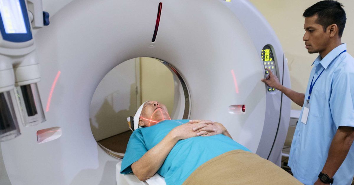 Doctor Shows The Process Of Scanning A Patient Stock Photo