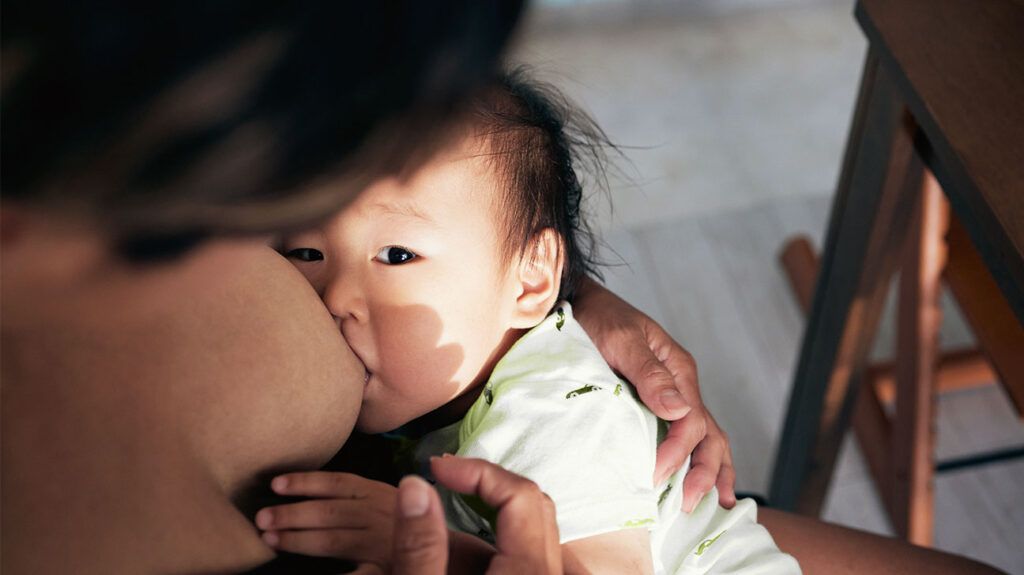 A person with hyperthyroidism breastfeeding a baby.-2
