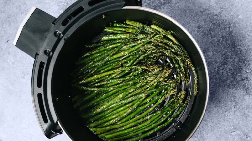 Cooked asparagus in an air fryer