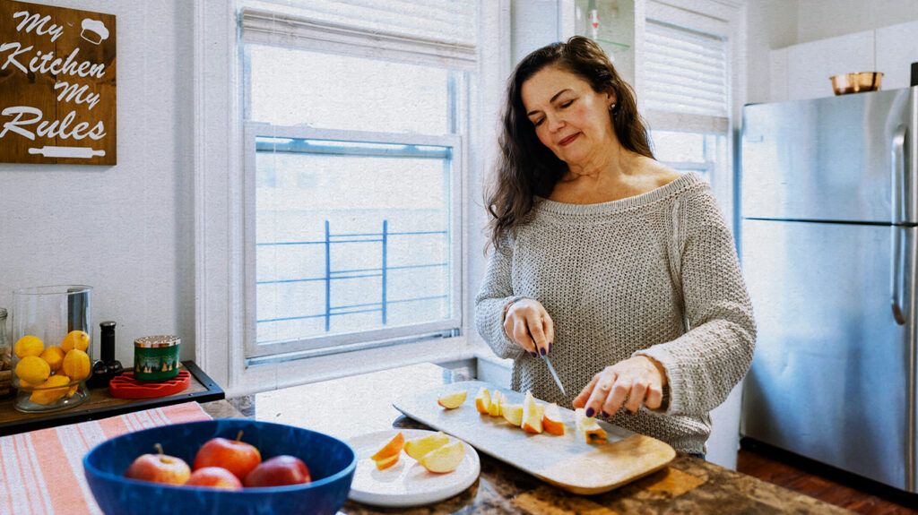 A woman preparing food that is beneficial for those with renal failure -2.