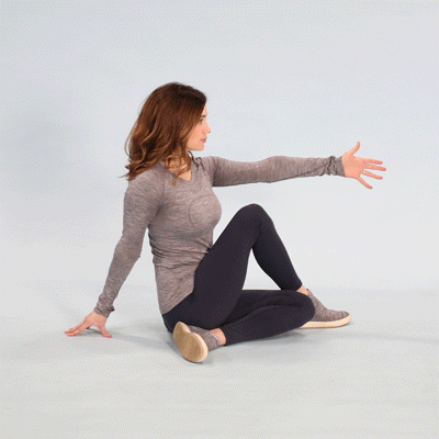 Person performing a half spinal twist