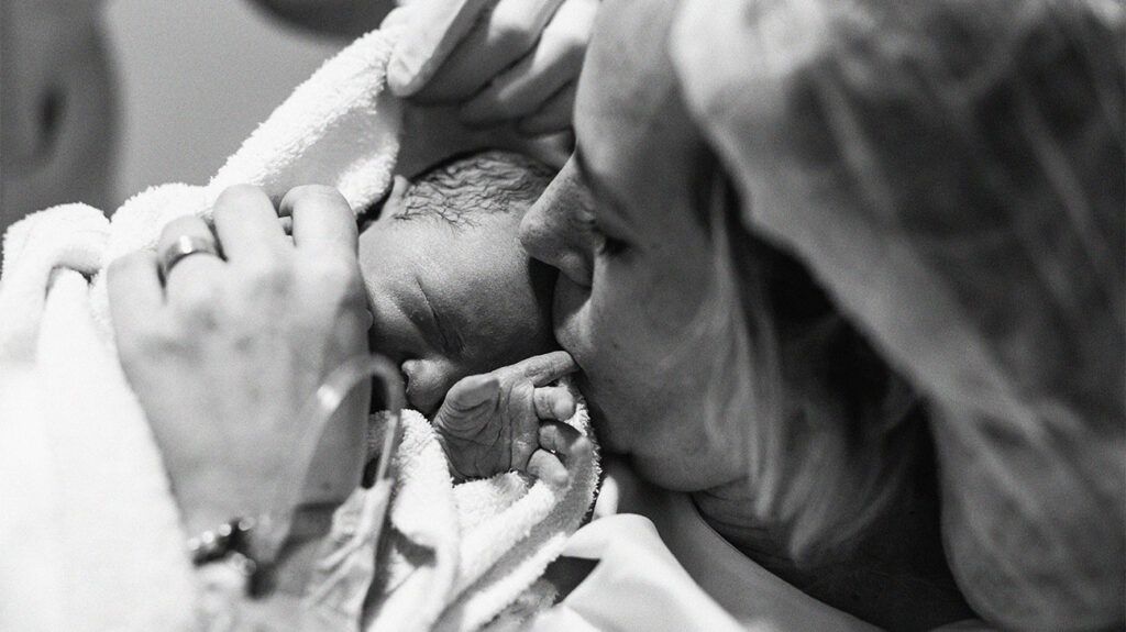 Mother holding her newborn baby-1