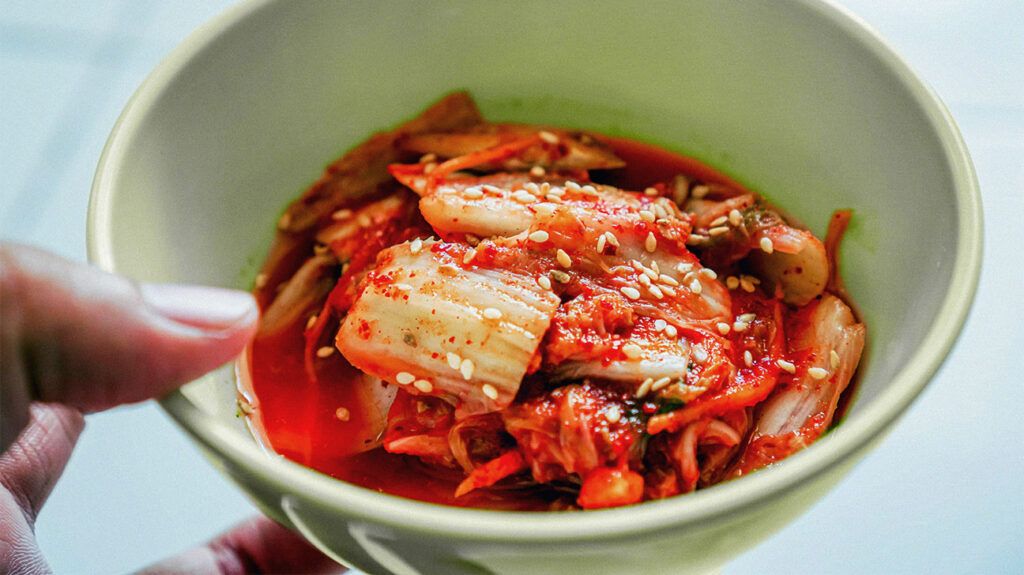 A bowl of homemade kimchi cabbage, a source of probiotics.