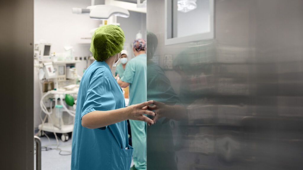 A person in an operating theatre preparing to perform pituitary tumor surgery -1.