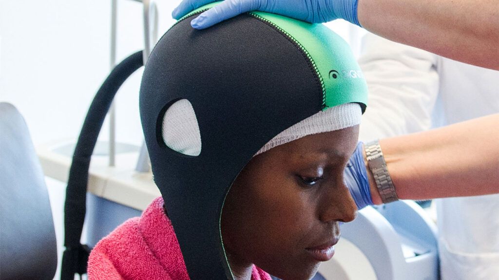 a person is undergoing chemotherapy and cold cap treatment