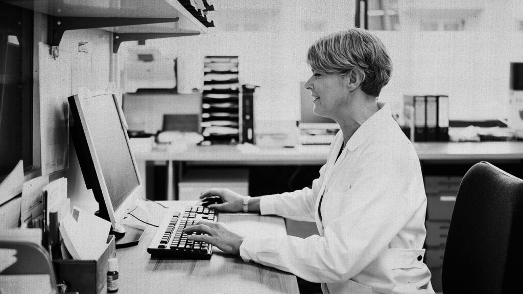 A healthcare professional using a computer 1