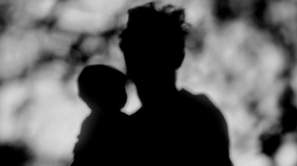 Silhouette of a parent and child -1.