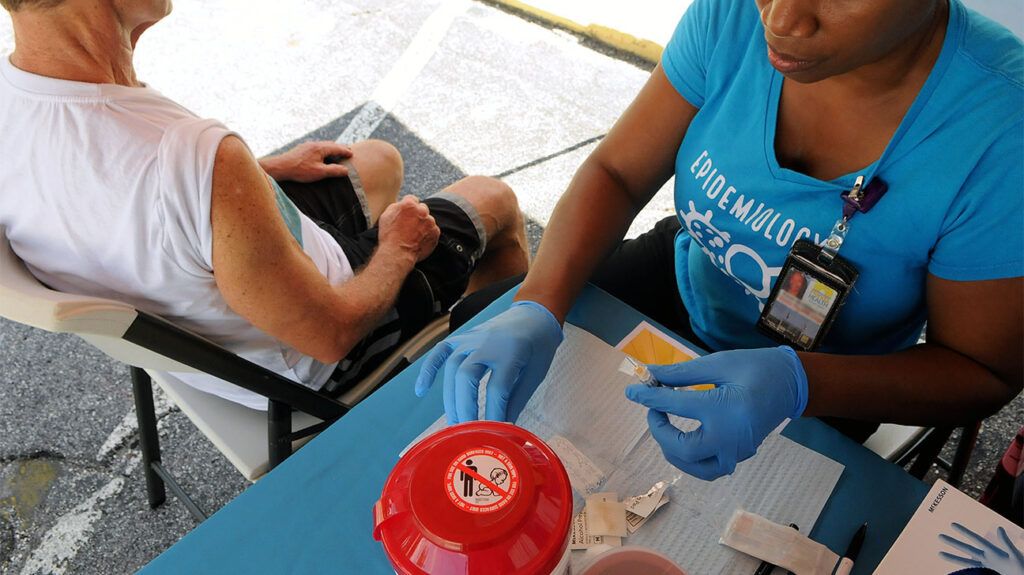 A healthcare professional administering a hepatitis A vaccine -2.