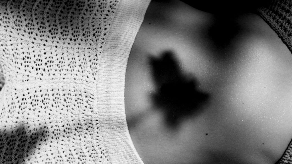 Shadow of a leaf on a person's back -1.