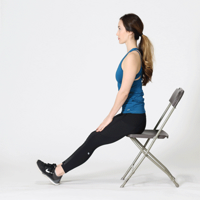 Female sitting in a chair demonstrating a hamstring stretch