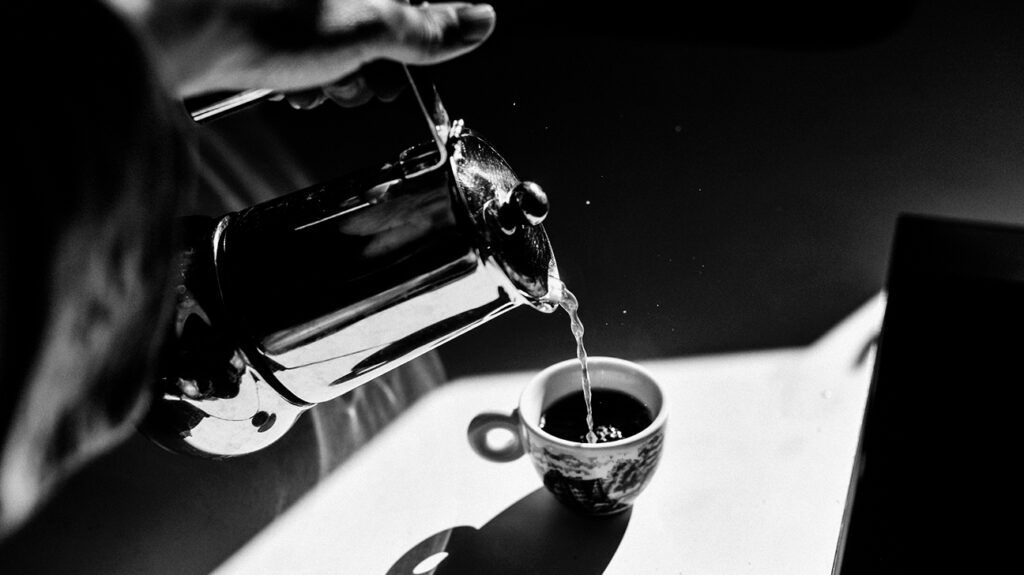 A person pouring coffee -1.