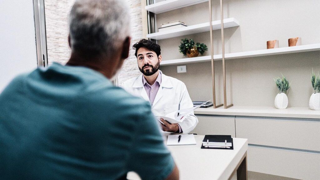 Doctor talking with his patient on a doctor's office