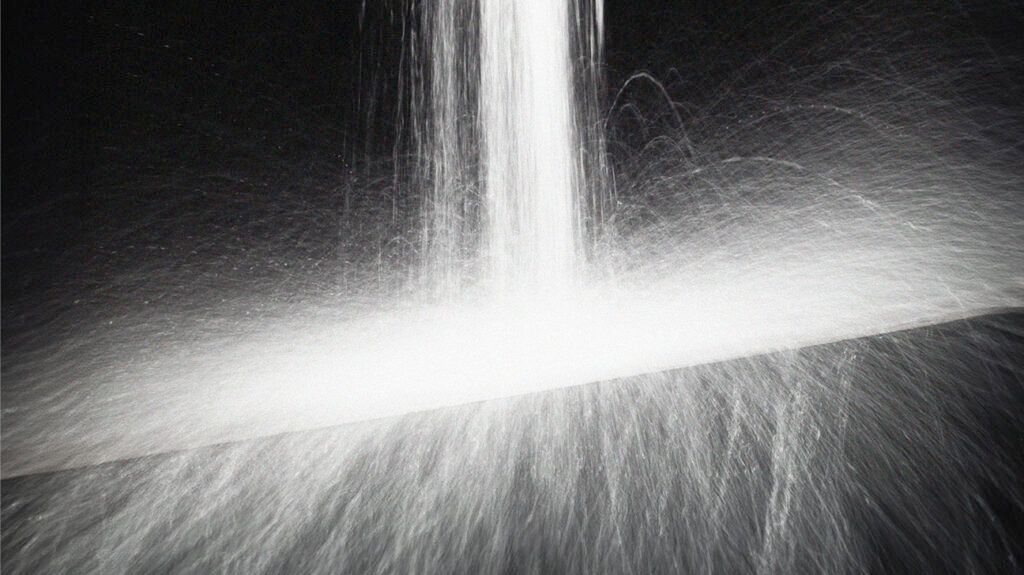 Waterfall splashing on black background