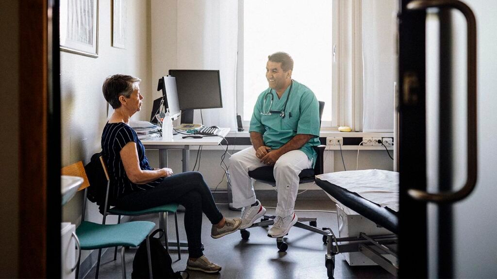 A person speaking with a doctor about a diurnal cortisol test.-2