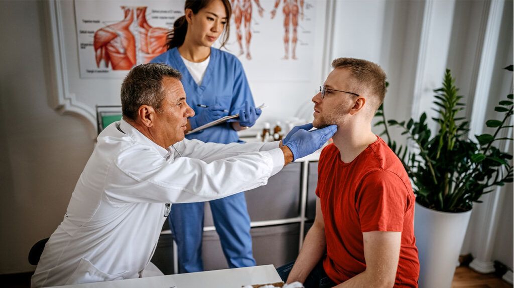 A doctor examining the throat of a person who is paranoid about throat cancer -1.