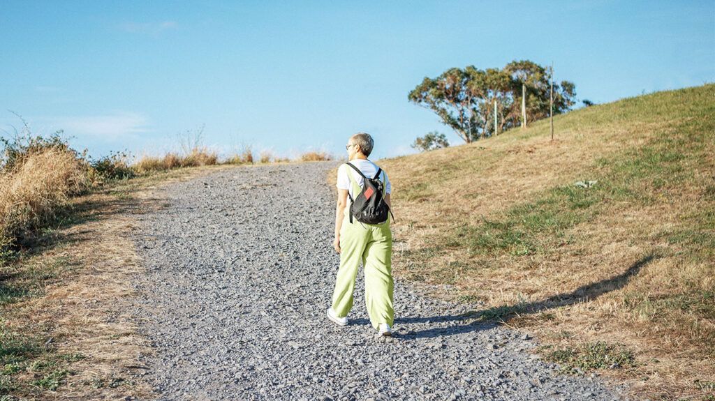 Mature woman hiking in the mountains along the sea