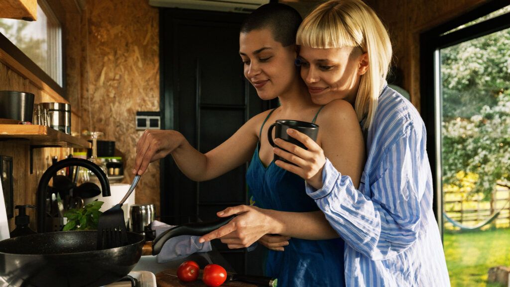 Female couple cooking in the kitchen