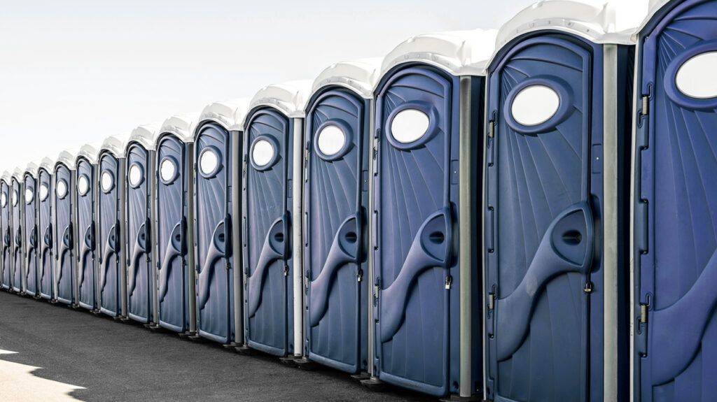 A row of portable toilets.