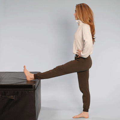 Standing hamstring stretch using a table