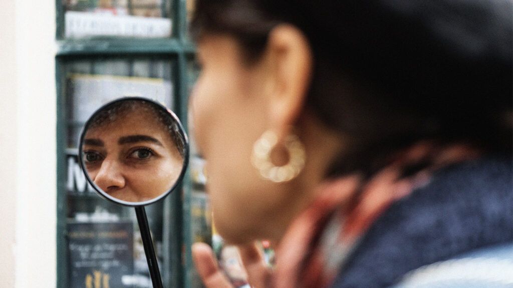 A person looking at themselves in a mirror-2.