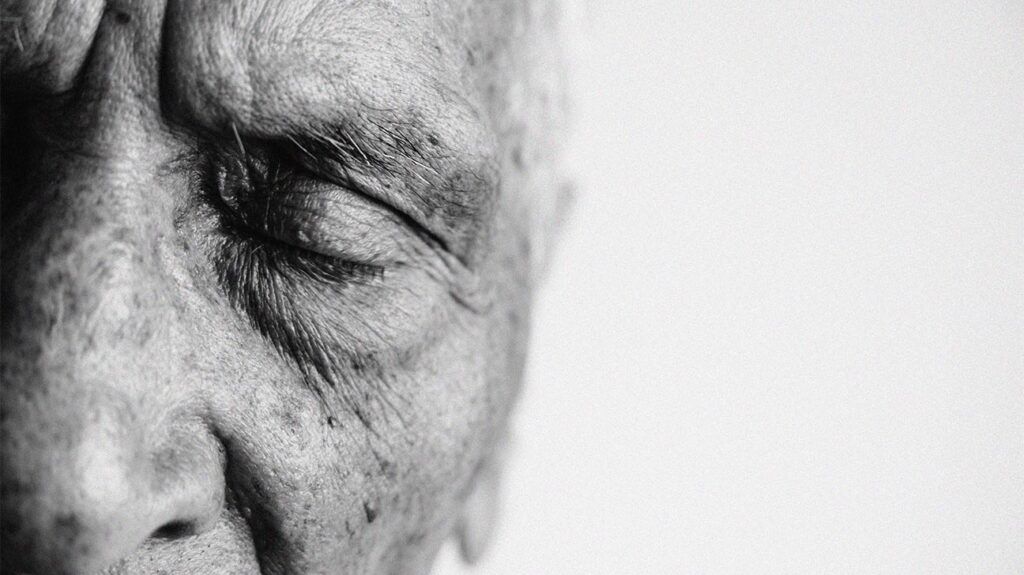 A close up of an old man's face