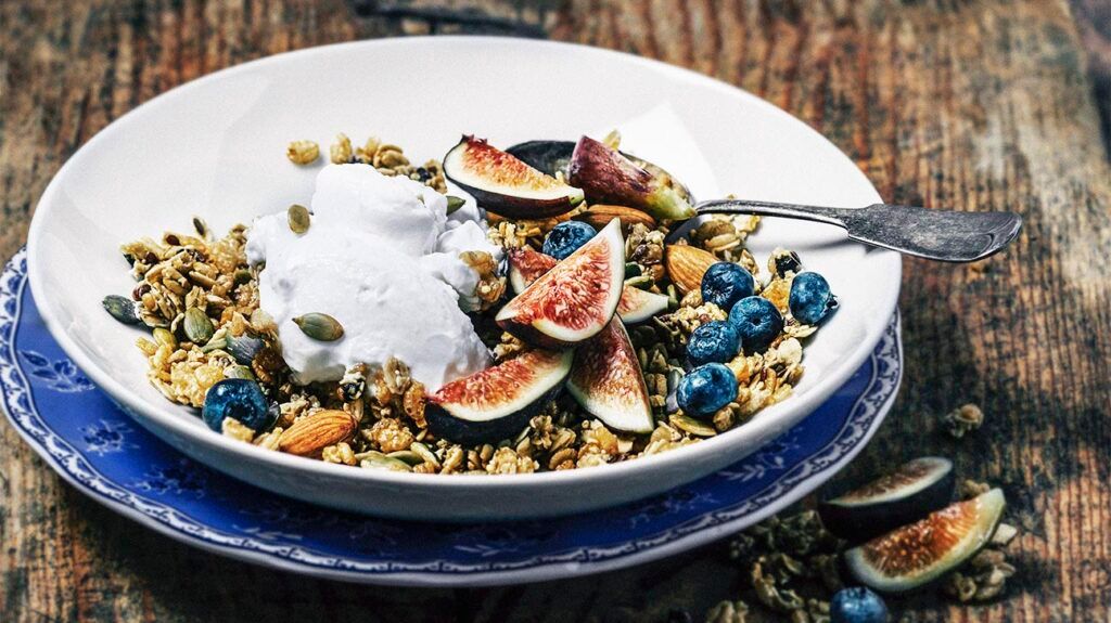 Breakfast bowl with figs and blueberries topped with probiotic rich yogurt