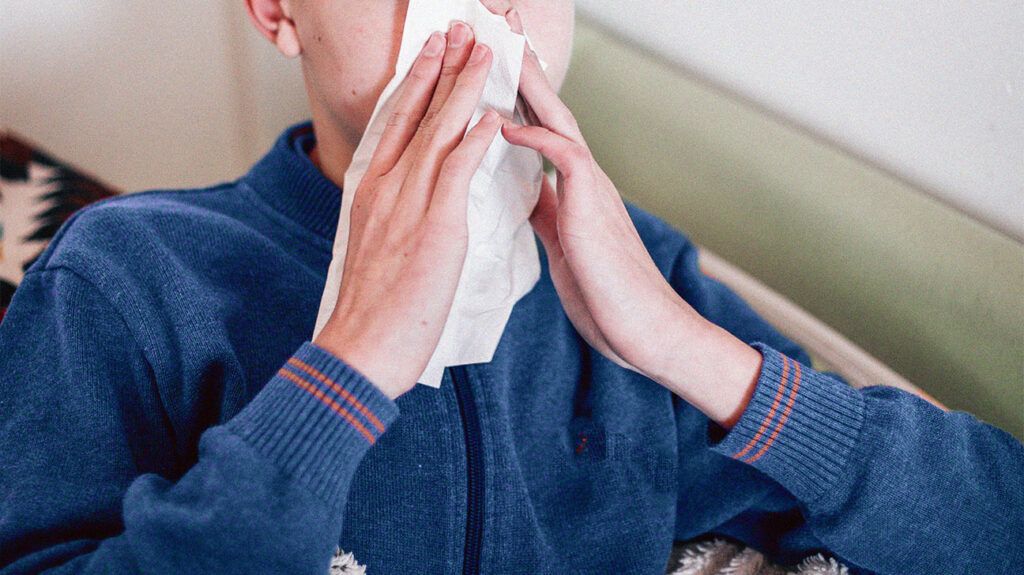 A person with cystic fibrosis mucus blowing their nose. -2