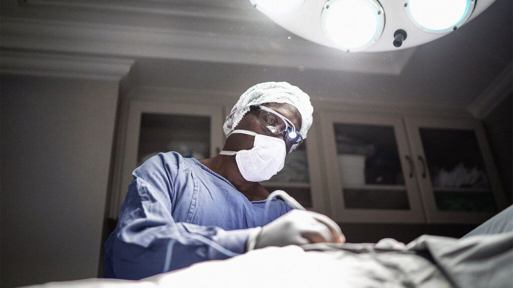 A surgeon is performing a procedure.