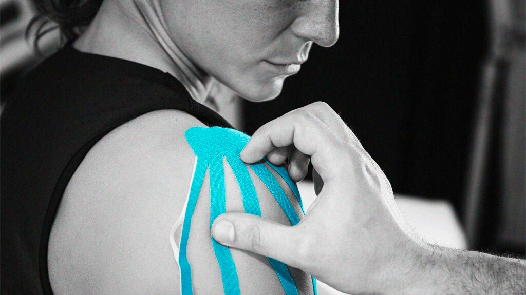 Kinesiology tape on a person's shoulder for pain treatment. -2