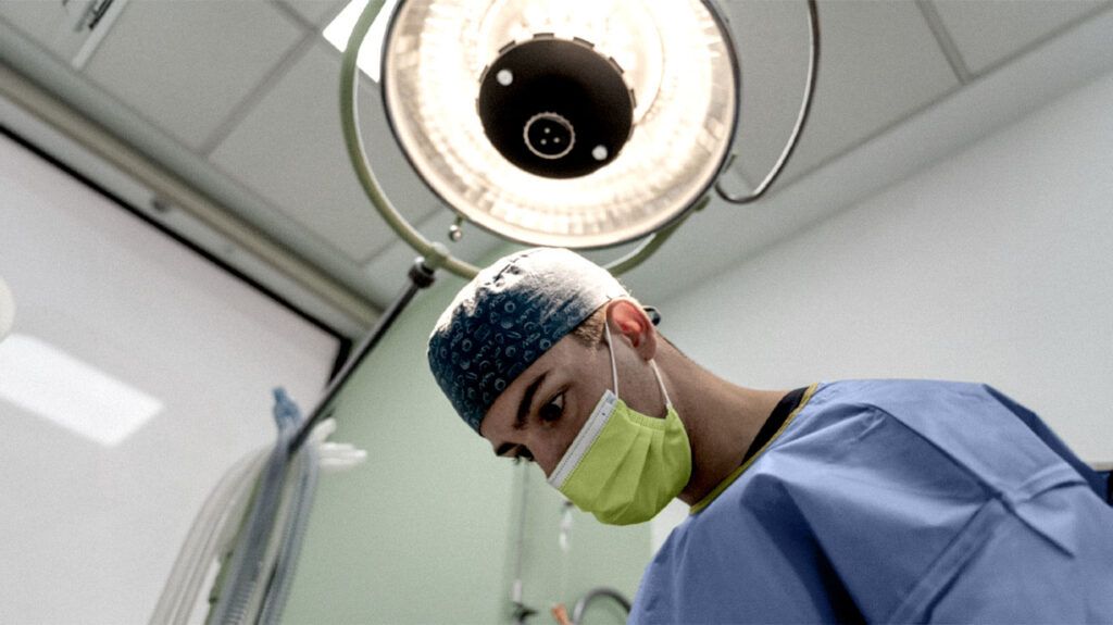 A surgeon is performing a procedure.