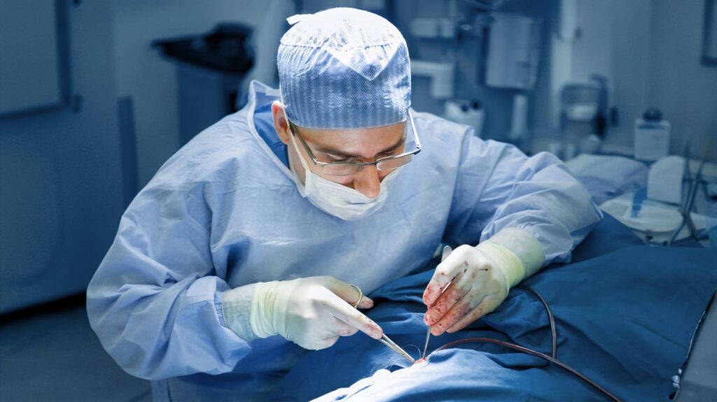 A surgeon working in the operating theater