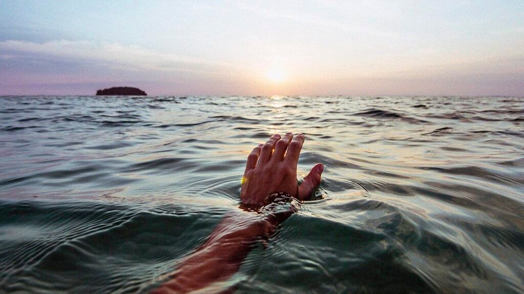A person's hand emerging from the water -2.