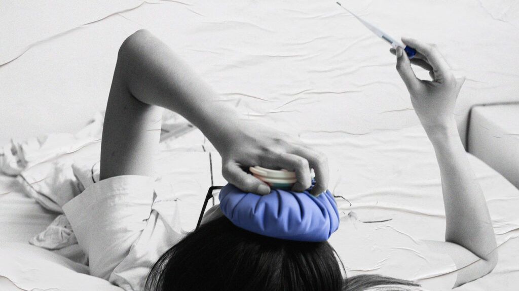 A person with cellulitis and a boil holding an ice pack against their head.-2