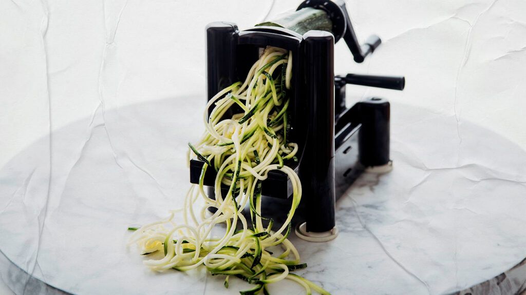 There is a spiralizer with zucchini noodles.