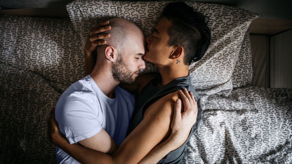 Two people hugging in bed -1.