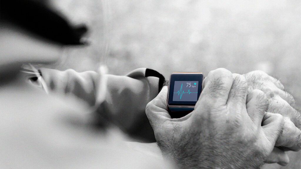 Person checking their heart rate on a smart watch