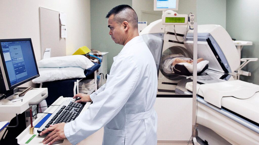 Doctor entering information on a computer