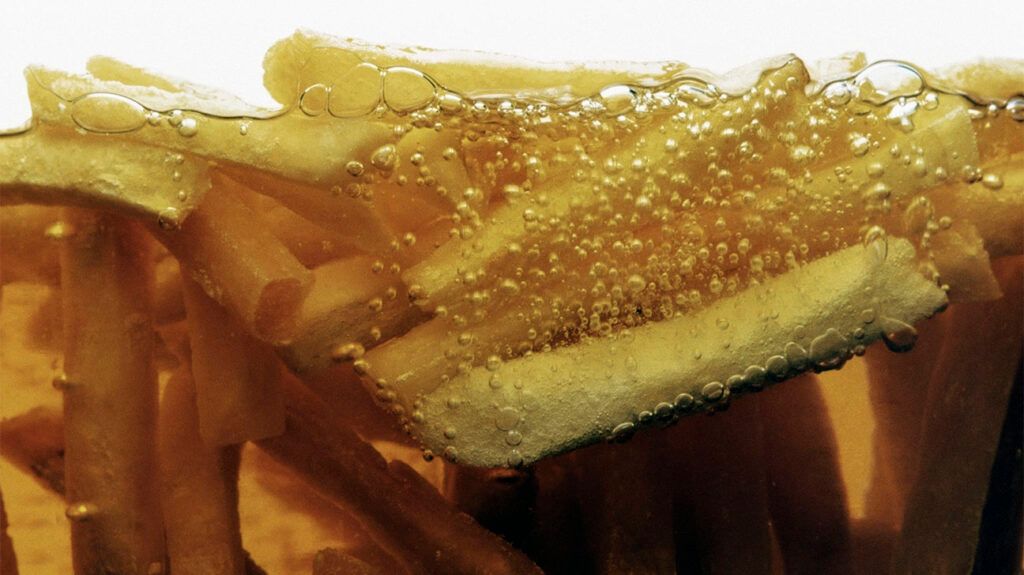 Close up cross-section of fries in a deep-fat fryer