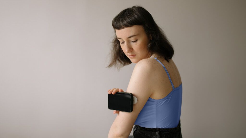 A person using a blood sugar monitor for diabetes 1