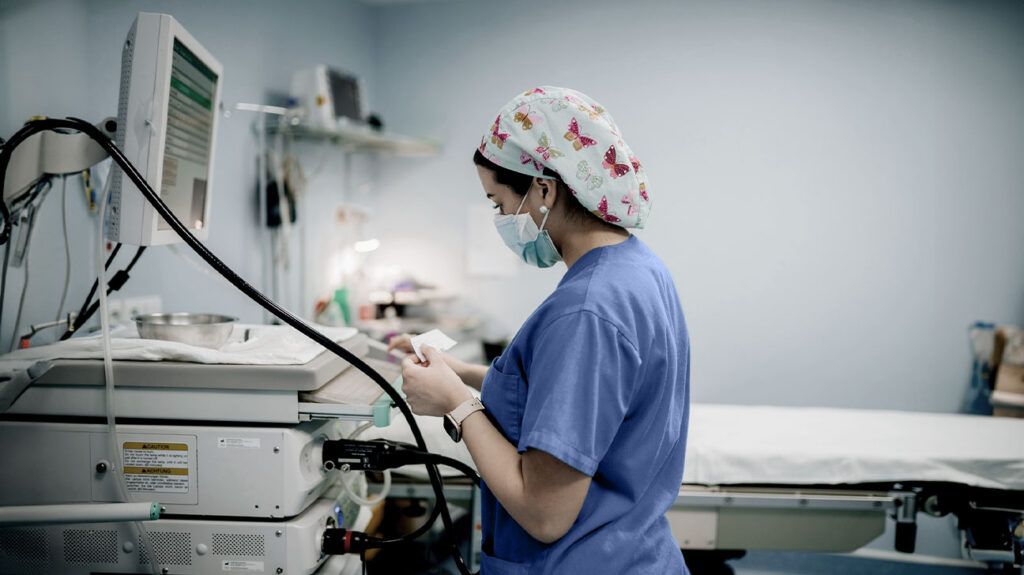 Healthcare professional preparing for a colonoscopy