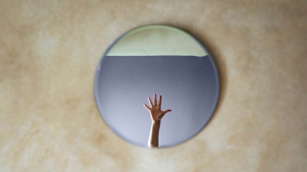 A person's hand in a mirror 1