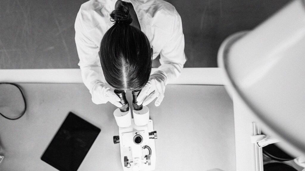 A scientist working with a microscope-2.