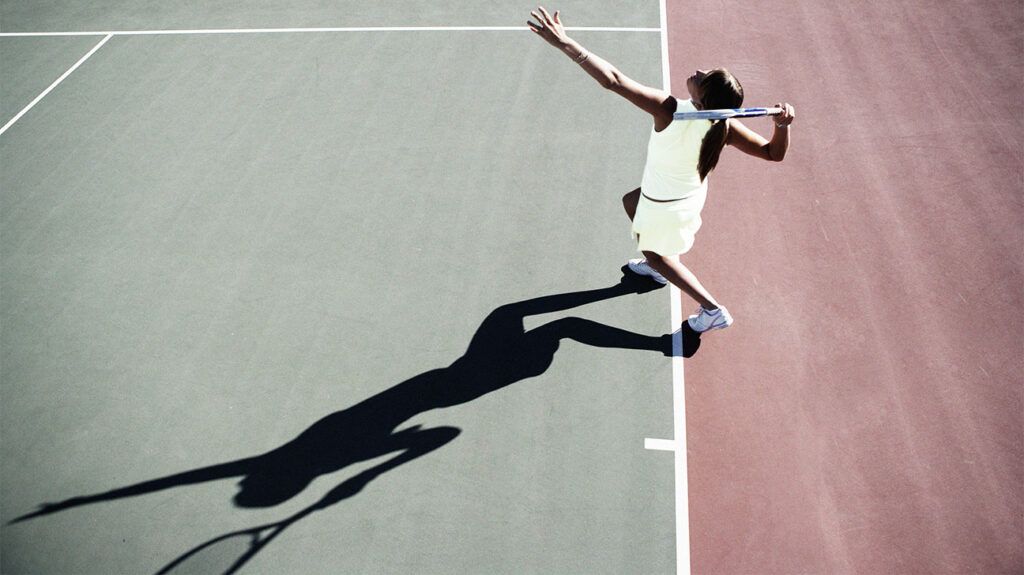 Female playing tennis