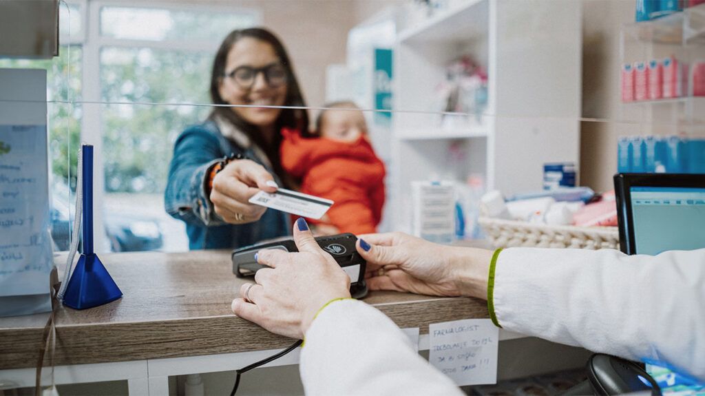 A person paying for medication at a pharmacy -1