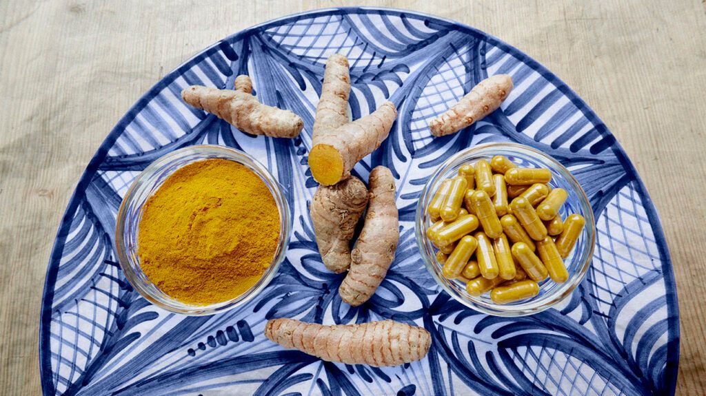 A plate of turmeric in root, powder, and pill form. -1      