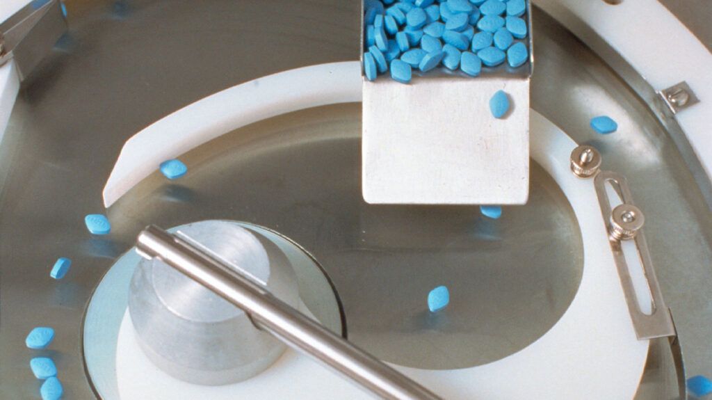 Blue Viagra pills in a factory