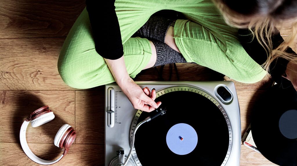 A person using a record player 1