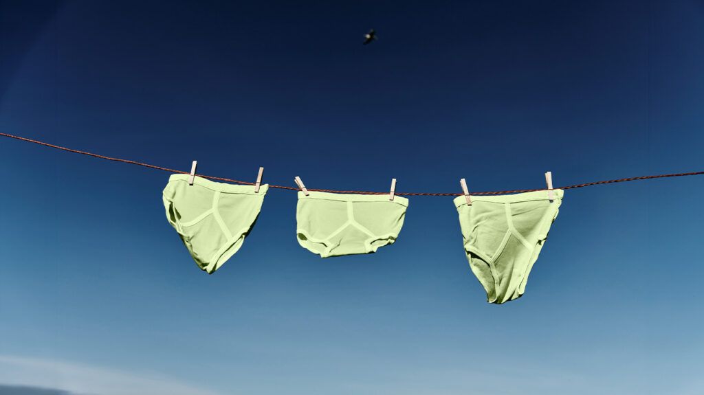 Green underwear drying on a washing line -1.